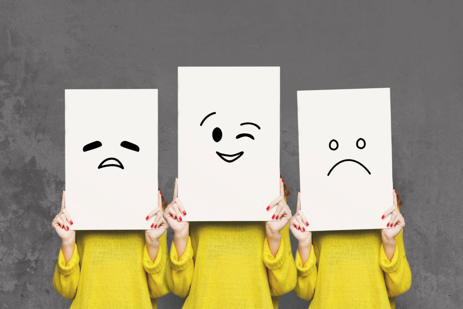 girl-covering-face-with-white-boards-set-of-painte-PJ3MXZZ.jpg